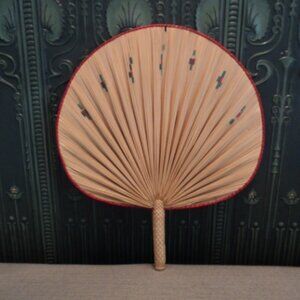 vintage wicker fan wall decor